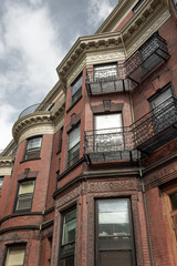 Ornate architectural details on urban brownstone apartments, city housing, horizontal aspect
