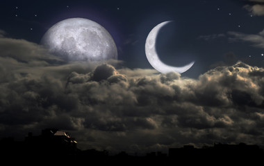 Fototapeta na wymiar full moon and new moon in the night sky