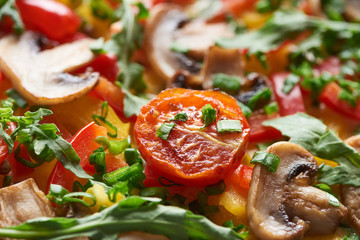 close up of delicious omelet with vegetables and greens