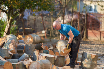 Lumberjack splitting wood with an axe