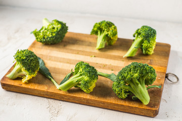 fresh broccoli on a wooden board