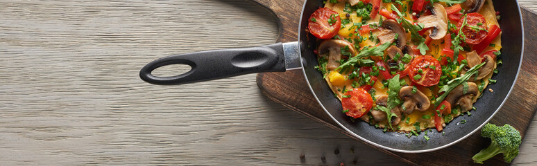 top view of homemade omelet in frying pan for breakfast