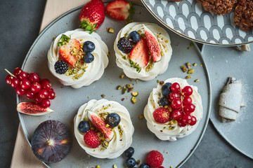 Mini Pavlova Cakes meringue dessert with berries