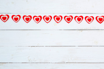 Garland of hearts on a wooden background. Valentine's Day
