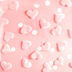 Beautiful silk pink hearts on a pink background. Holiday concept Valentine Day. Plase for text . Flat lay.
