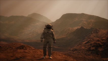 Spaceman walks on the red planet Mars. Space Mission. Elements of this image furnished by NASA © icetray
