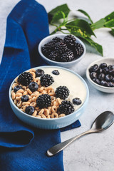 Bowl filled with corn ring cereals and berries. Healthy breakfast