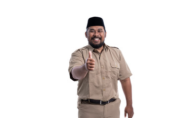 Obraz premium man in brown khaki uniform showing thumb up. indonesian government worker