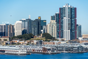 Naklejka premium Business district skyscraper near Harbour Bridge with views of Pier Event Sydney Harbour and Theatre, Australia