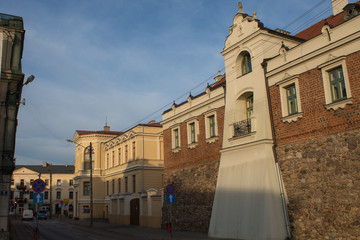 Obraz premium Cityscape of the historical streets of the Old Town in the center of Poland Piotrkow-trybunalski, which is 800 years old: architecture, fortress, churches.