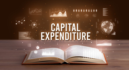 CAPITAL EXPENDITURE inscription coming out from an open book, creative business concept