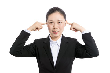 Young beautiful brunette businesswoman smiling looking at camera pointing finger in side over white background.
