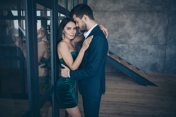 Profile photo of horny couple guy stylish trendy lady leaning glass wall door tempting prelude intimate erotic desire wear formalwear blue suit short shiny dress loft industrial indoors