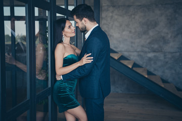Profile photo of tenderness stylish trendy couple guy lady leaning glass wall door tempting prelude intimate erotic wish wear fancy formalwear blue suit short shiny dress loft indoors