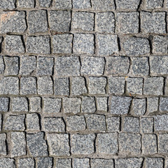 Fototapeta premium Seamless texture of sidewalk pavement made of gray granite blocks. Wroclaw. Poland.
