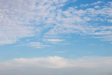 Obraz premium Fantastic soft white clouds against blue sky background.
