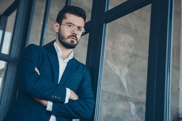 Photo of handsome business guy preparing for important seminar thinking over speech little worried in modern trendy office indoors wear specs formalwear blue plaid costume