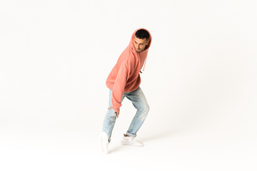 Man dancing street dance style over isolated white background