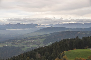a zeppelin airship flying over the Alps seen from the Pfänder, Voralberg, Austria © Simo