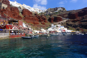 Fototapeta na wymiar Photo from picturesque fishing harbour and bay of Ammoudi below iconic and famous village of Oia, Santorini island, Cyclades