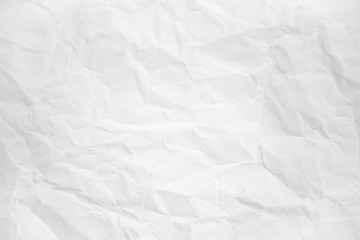 white and gray wide crumpled paper texture background. crush paper so that it becomes creased and wrinkled.