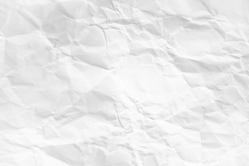white and gray wide crumpled paper texture background. crush paper so that it becomes creased and wrinkled.
