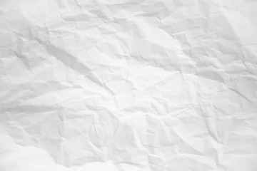 white and gray wide crumpled paper texture background. crush paper so that it becomes creased and...