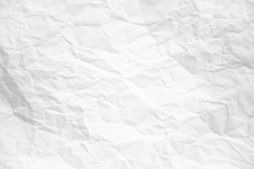 white and gray wide crumpled paper texture background. crush paper so that it becomes creased and wrinkled.