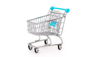 Miniature shopping cart isolated on completely white background
