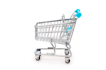 Side view of a miniature shopping cart isolated on completely white background