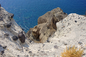 Volcanic beach creating a geological phenomenon and beautiful seascape created by lava in iconic island of Santorini, Cyclades, Greece