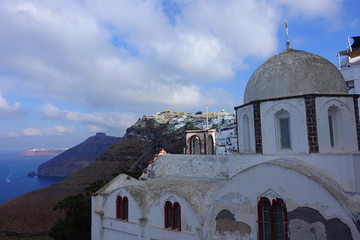 Fototapeta na wymiar Photo from picturesque orthodox chapel in beautiful village of Fira overlooking the caldera, Santorini island, Cyclades, Greece