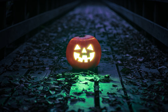 Halloween pumpkin over the bridge