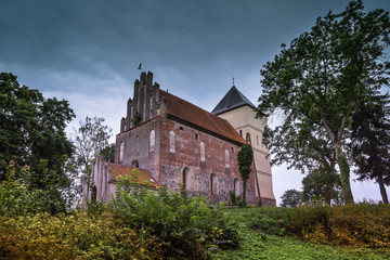 Fototapeta premium Teutonic castle from the end of the 14th century. In 1513, the stronghold was turned into a church. Bezławki, Poland.