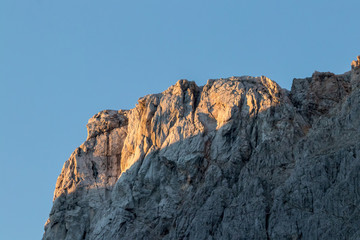 Sunlit mountain peak in the morning