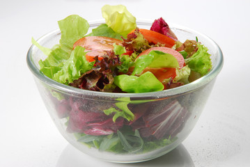 fresh salad in a bowl isolated on white