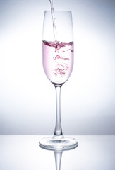 A glass of wine to add water.