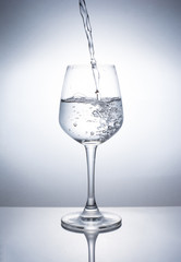 A glass of wine to add water.