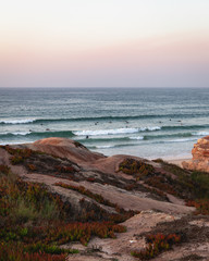 Fototapeta na wymiar Surfing in to the sunset