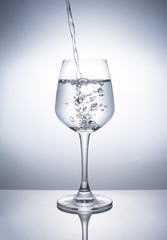 A glass of wine to add water.