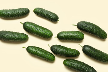 Fresh green cucumbers on light background