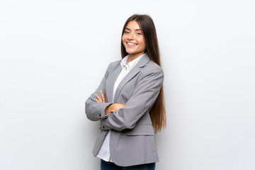 Young business woman over isolated white background with arms crossed and looking forward