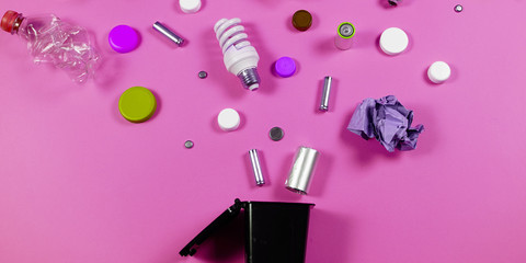 Trash bins and assorted garbage isolated on green, recycle concept,