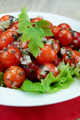 cherry tomatoes in vinaigrette on a plate