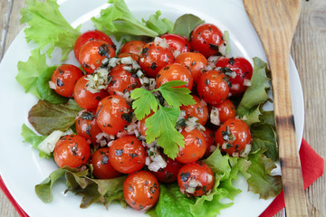 cherry tomatoes in vinaigrette on a plate
