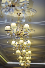 Fototapeta na wymiar beautiful crystal chandelier in the wedding hall