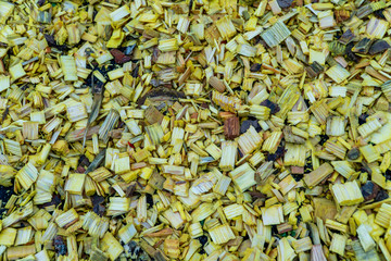 Colored textured sawdust. Small pieces of wood of different sizes.