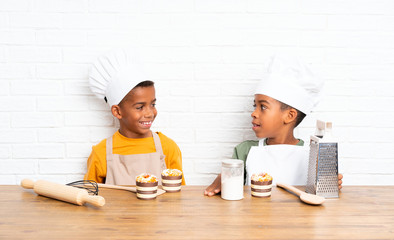 Happy Two African American brothers kids dressed as chef