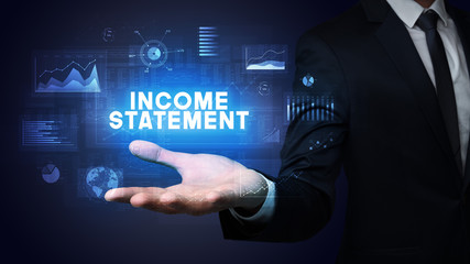 Hand of Businessman holding INCOME STATEMENT inscription, business success concept