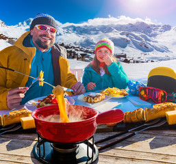 Ski restaurant lunch break with Fondue cheese, mountain view of Val Thorens, 3 valleys , France.